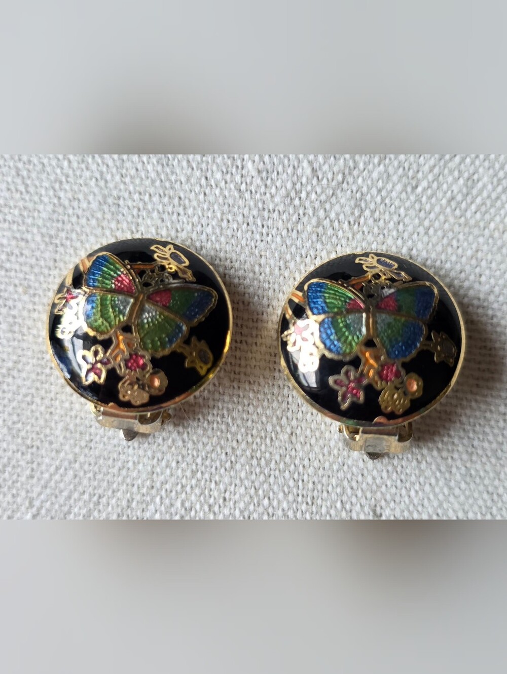 Vintage cloisonné clip-on earrings featuring a butterfly and floral motif